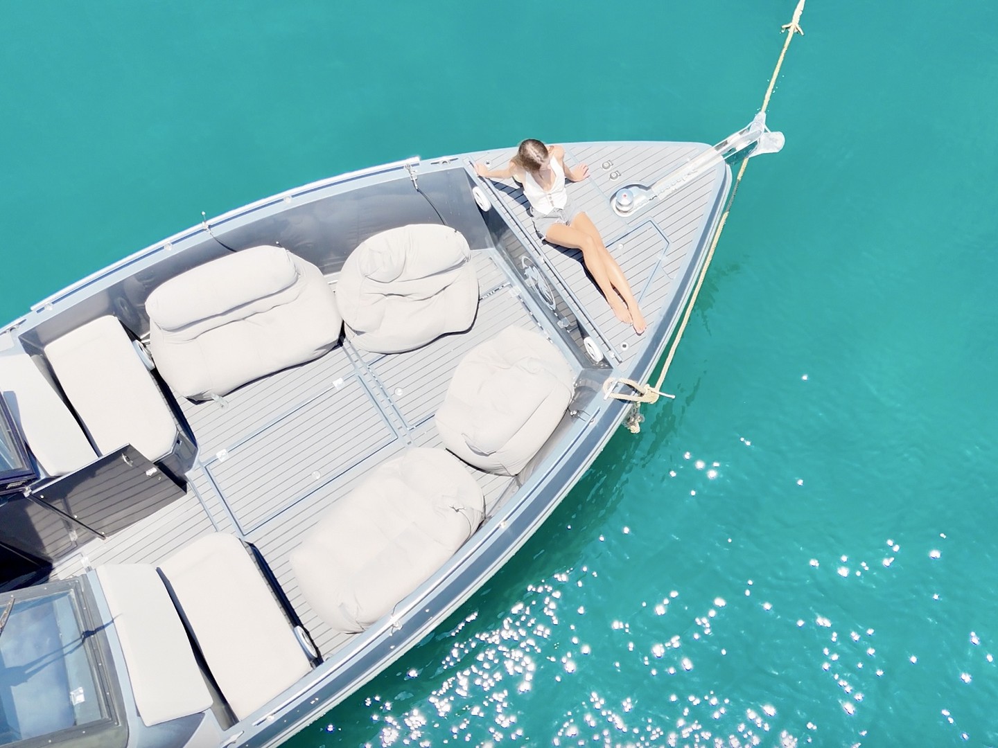 Aerial of the Silvercraft 36HT's bow lounge and sunpads over turquoise water
