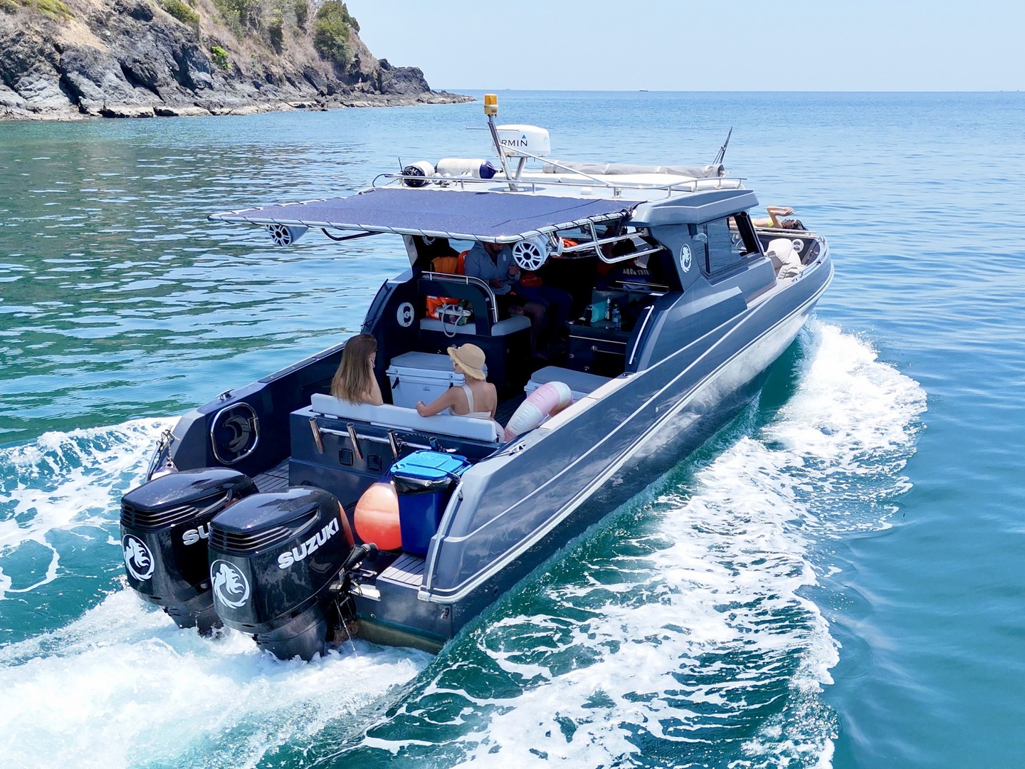 Three-quarter view of the Silvercraft 36HT cruising with guests and a wake