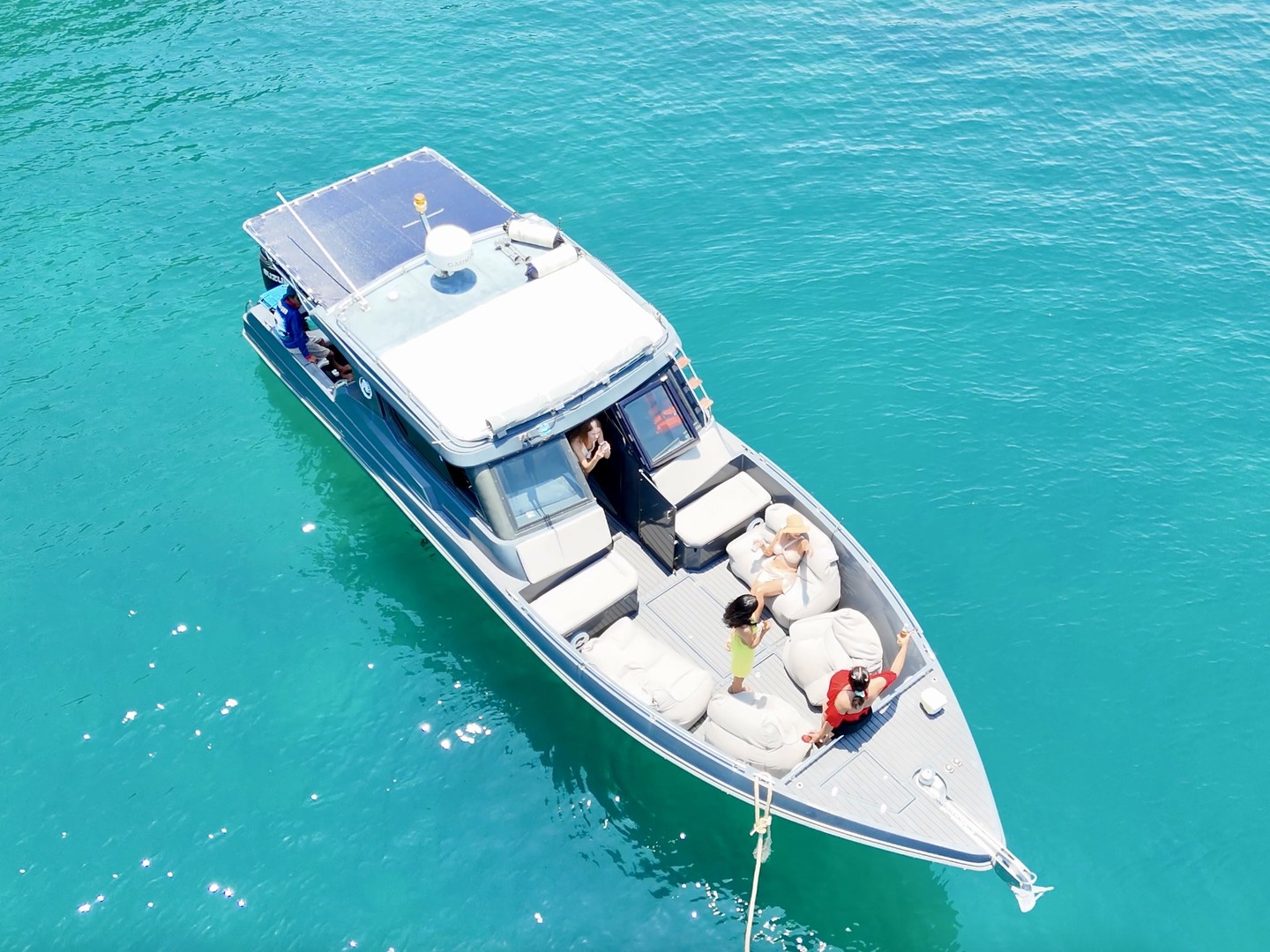 Aerial top-down of the Silvercraft 36HT at rest with guests on the deck