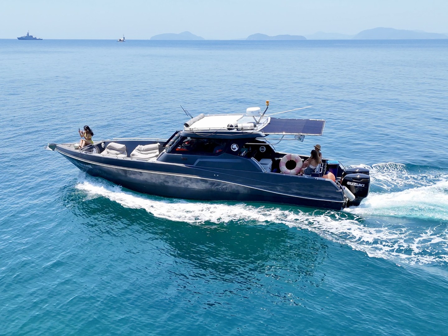 Side view of the Silvercraft 36HT cruising with guests aboard