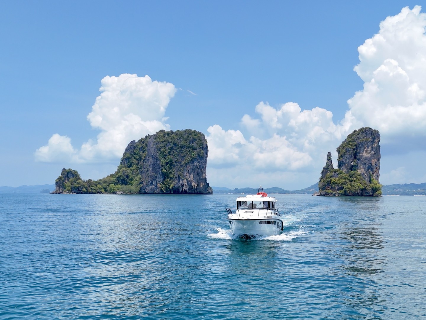 Finnmaster Pilot cruising between twin karst islands