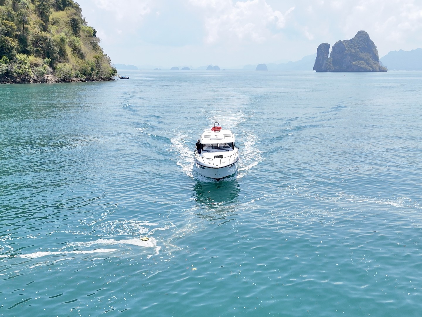 Finnmaster Pilot cruising toward a Phang Nga karst