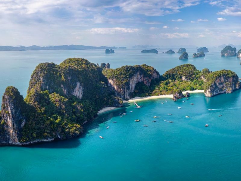 Aerial view of the Hong Island group scattered across turquoise water, with boats at anchor