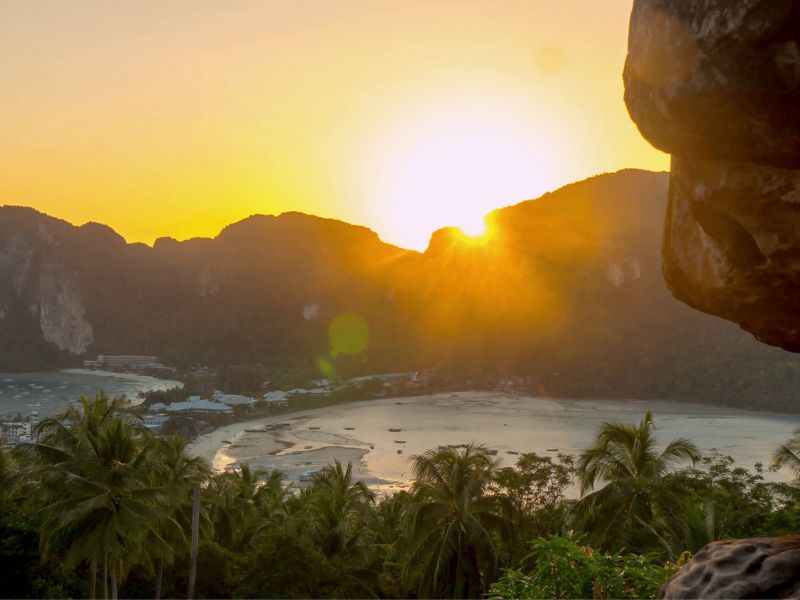 Sunset from the Phi Phi Don viewpoint looking down over the twin bays and palm-lined shore