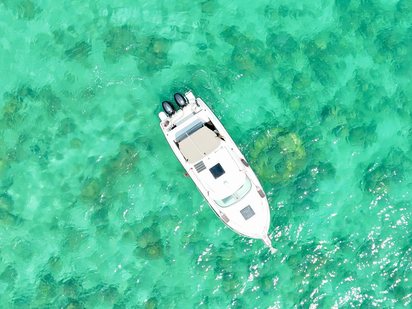 Overhead view of Atomix 705HT in clear turquoise water.