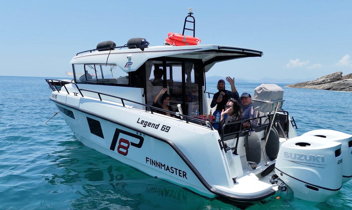 A Finnmaster boat from the AquaTour fleet on the water with guests aboard