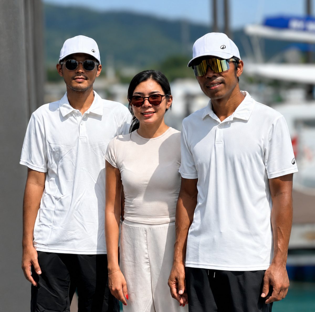 AquaTour team members together at a Phuket marina